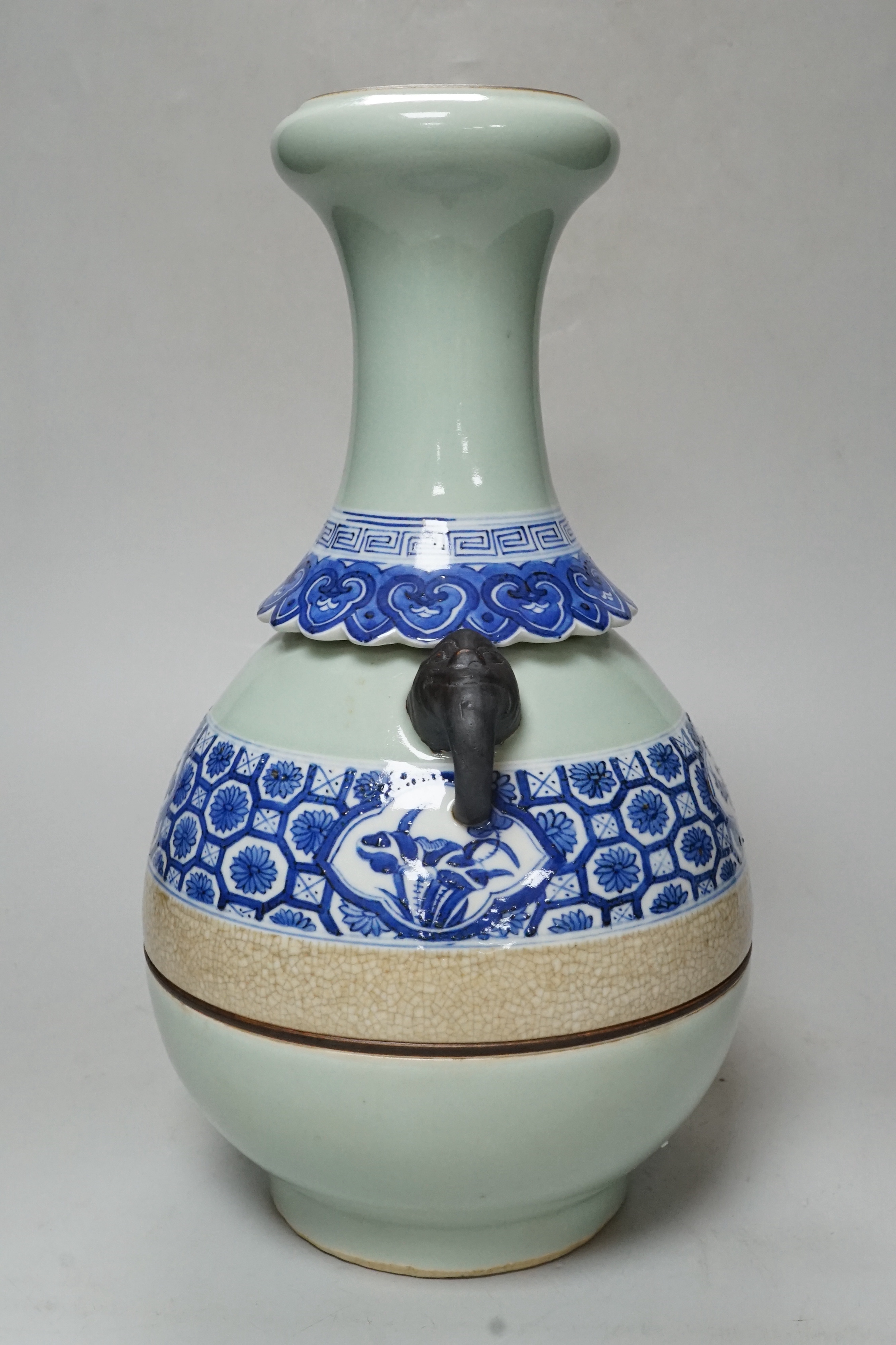 A Chinese celadon and underglaze blue two handled vase, 33cm tall